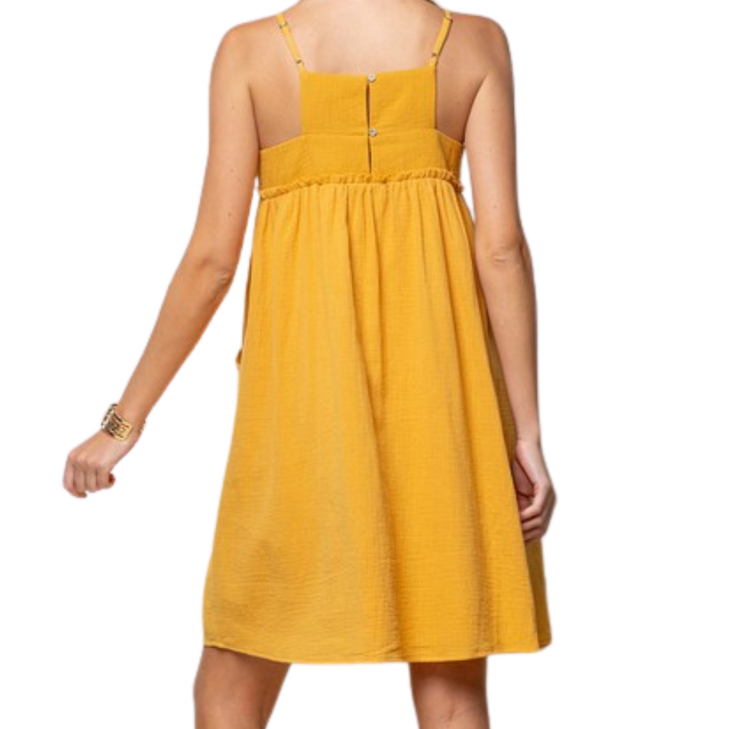 Yellow mini dress made from gauze material, with pockets and a square neckline, worn by a woman from the back.