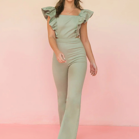 Light green jumpsuit with ruffle sleeves, flared leg, and side cutouts, worn by a woman from the front.
