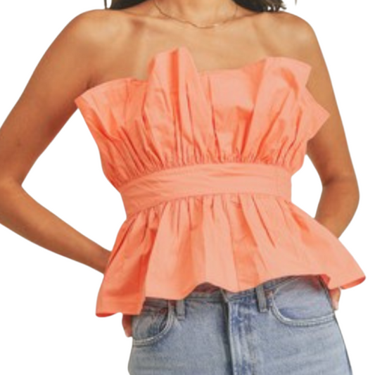 Peach ruffle tube top with fitted waist, worn by a woman from the front.